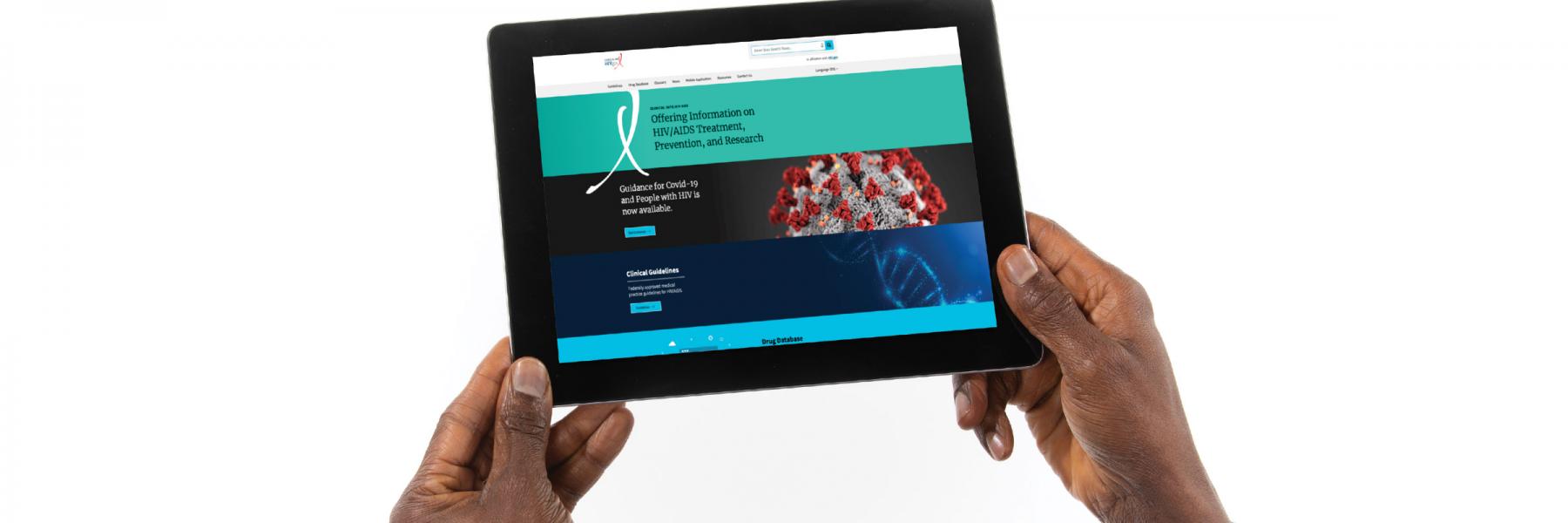 The web page of the DHHS HIV treatment guidelines appears on a tablet device being held by  hands