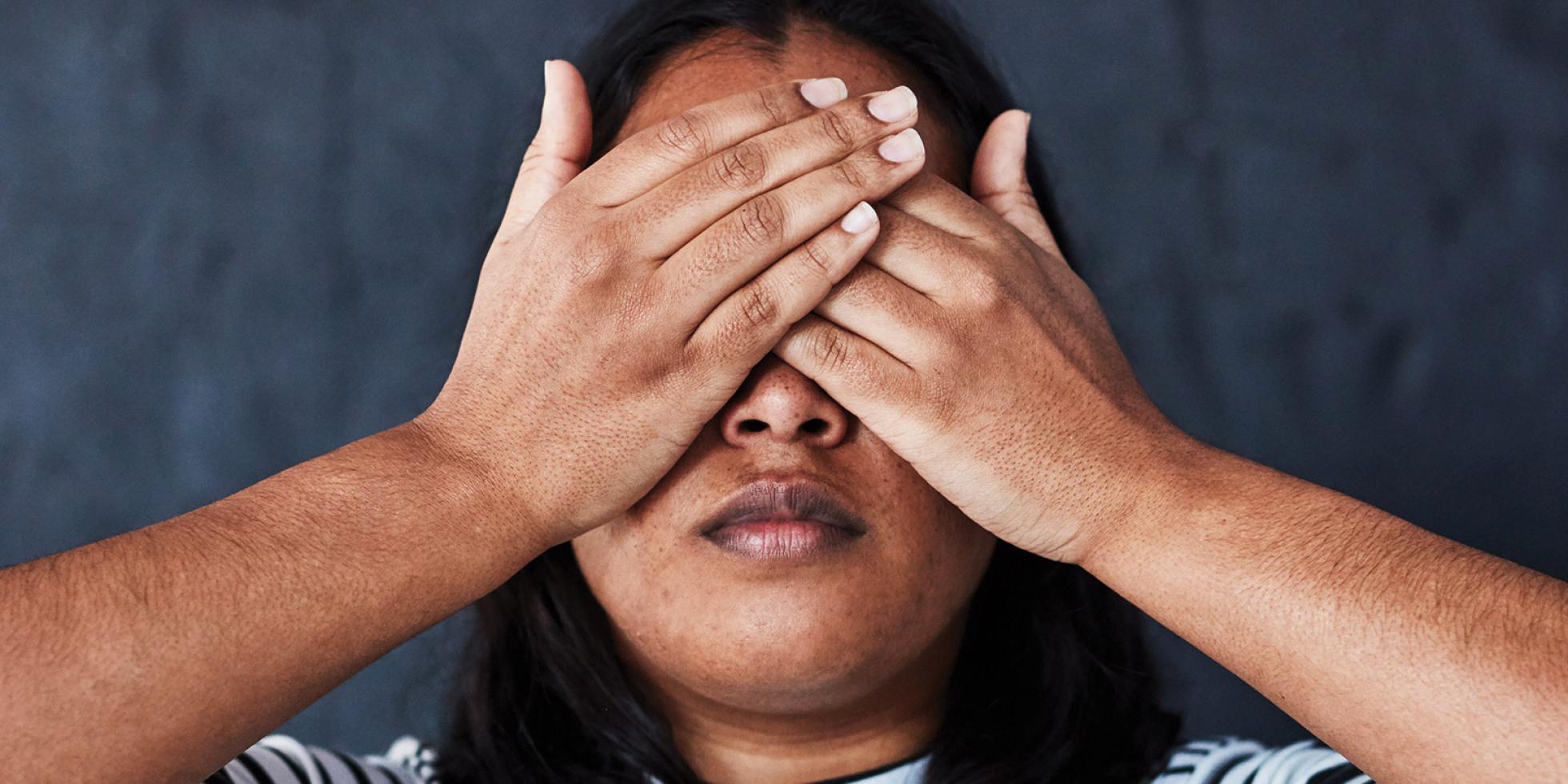  A woman covering her eyes